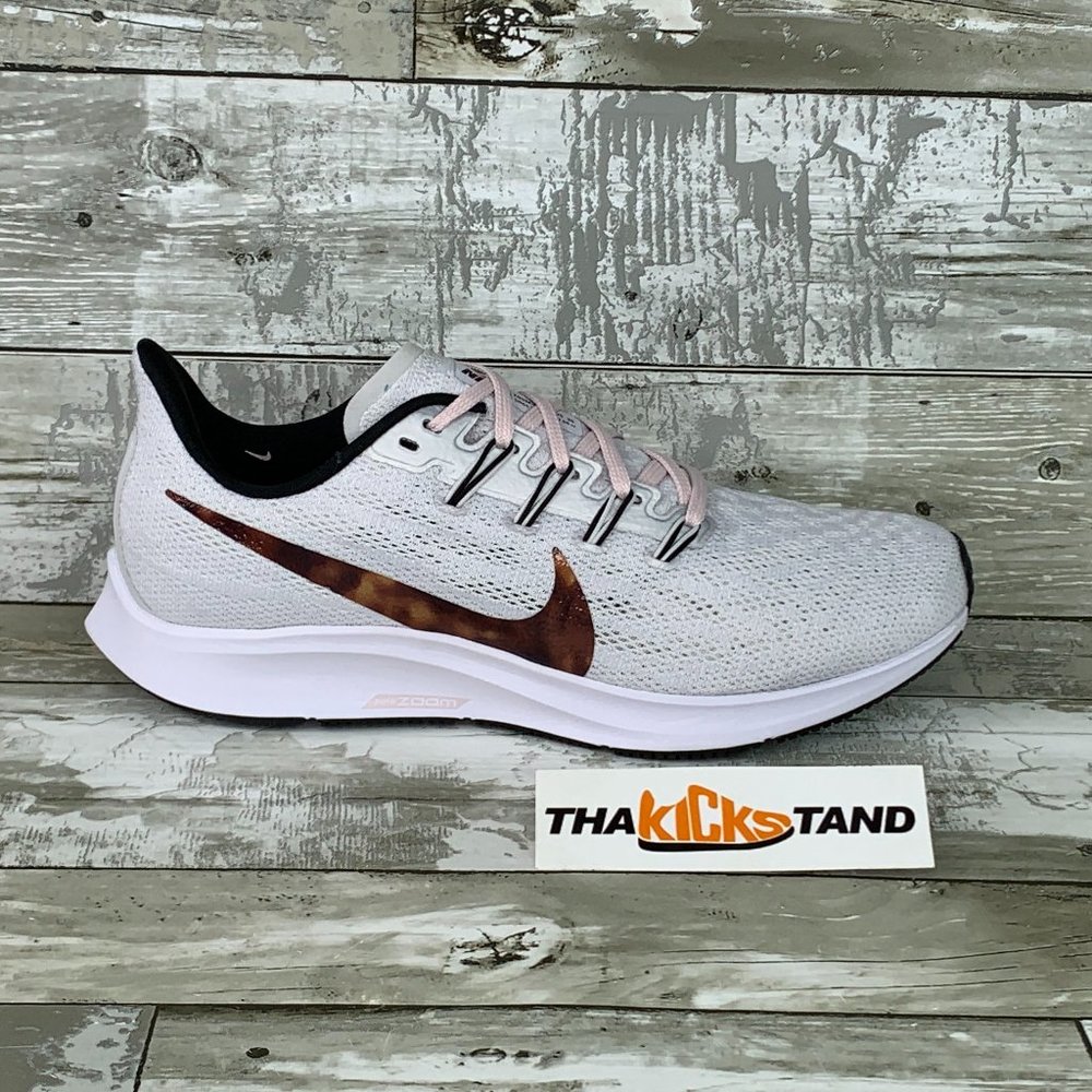 Nike Women's White Pink Lace Running Shoes with Brown Swoosh